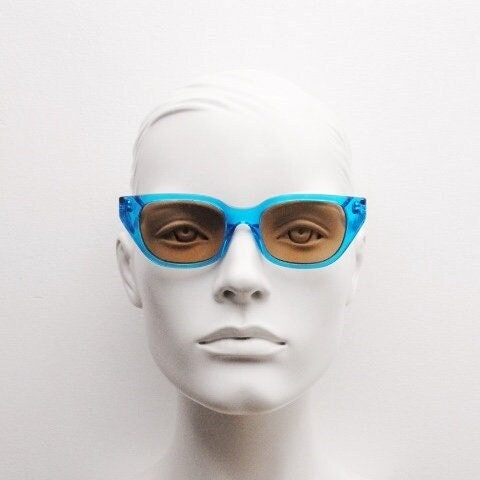 Retrosuperfuture thick cat eye sunglasses hand made in Italy. Intense blue acetate chunky frame with contrasting brown lenses. BNWOT