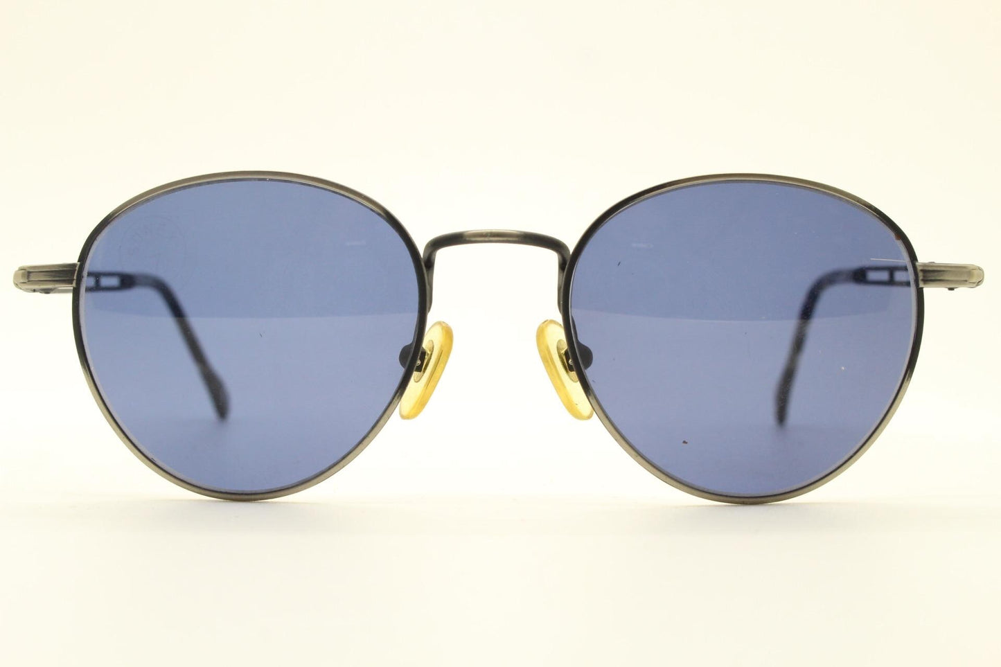 90s vintage metal oval sunglasses. Minimal brushed bronze finish brown frame with grey lenses and detailed arms. Steampunk. Panto. NOS