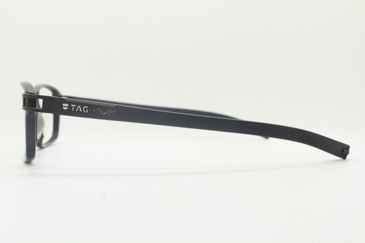 Tag Heuer rectangular eye glasses. Patented design made in France. Solid acetate optical frame with flexible rubber arms. Prescription RX