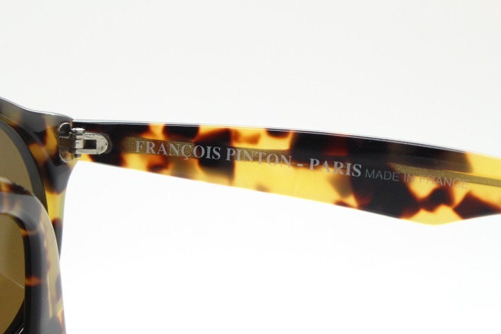 Francois Pinton Paris 90s vintage round sunglasses made in France. Womens thick acetate frame in honey tortoise brown tones. NOS
