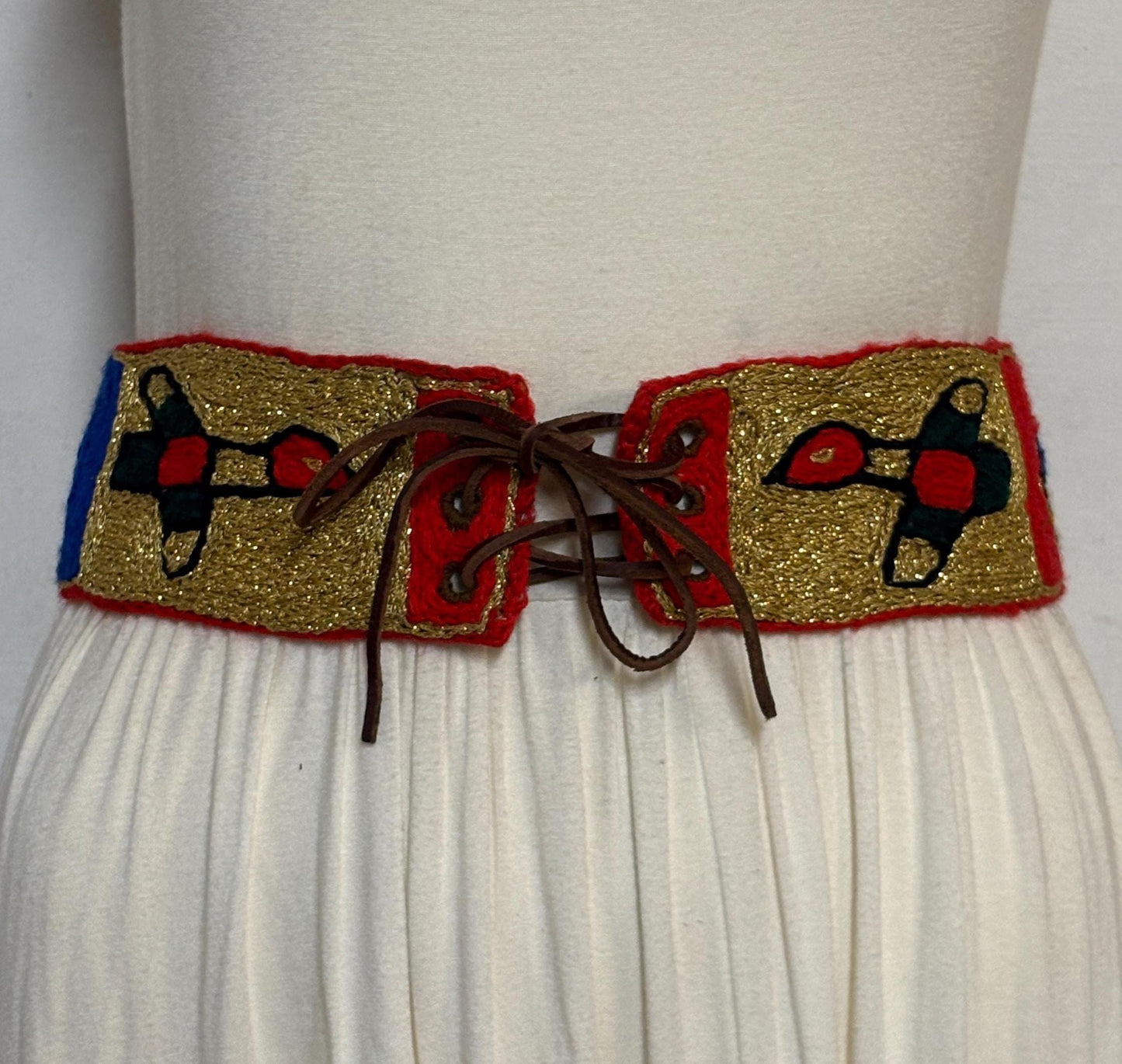 60s vintage completely hand made knitted belt. Embroidered sun, bird and abstract symbols with leather laced tie. Womens unique one off