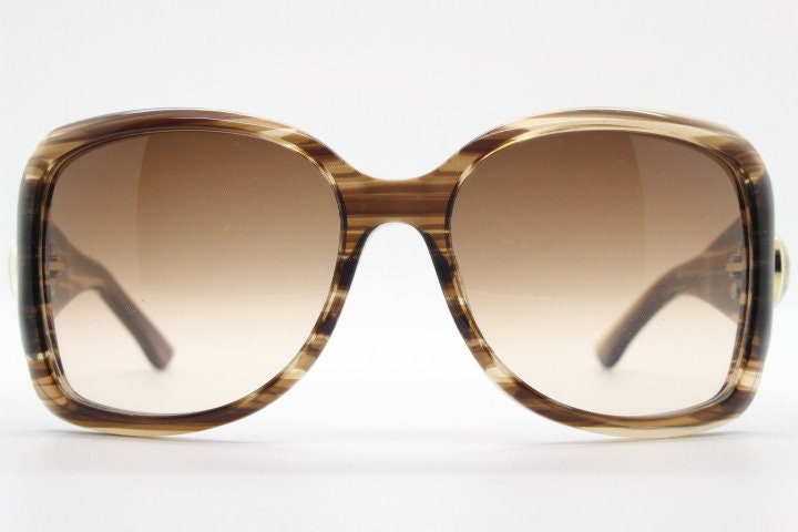 Gucci Y2K vintage oversized square sunglasses made in Italy. Transparent mottled brown frame with glitter sparkles and big stand out logo