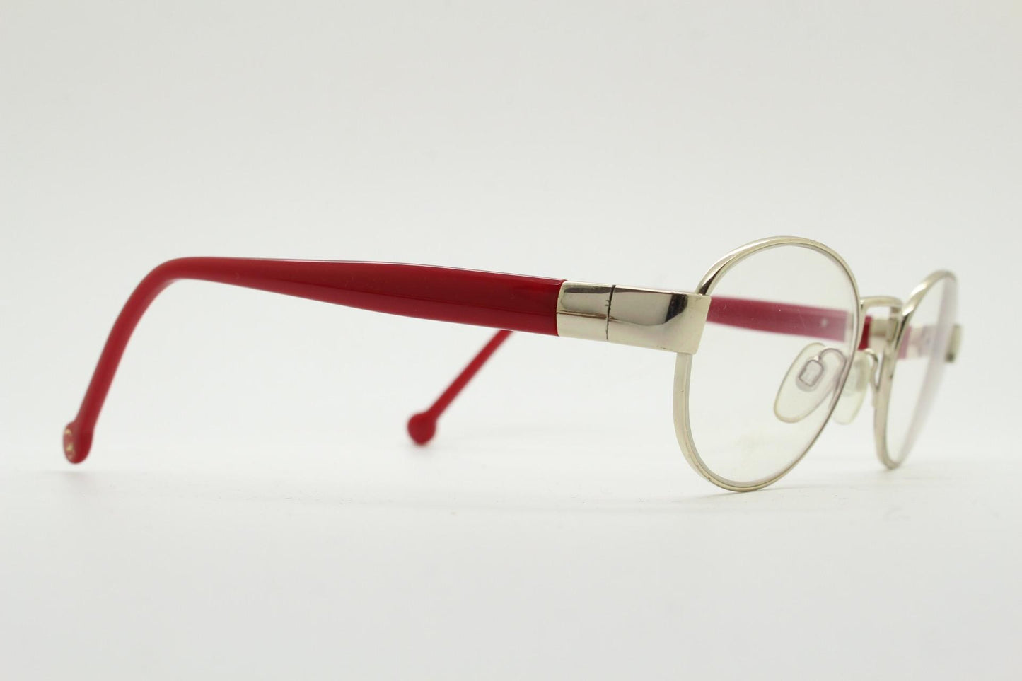 Red or Dead Y2K vintage oval eye glasses. Green or red interchangeable arms on a chrome metal frame. Optical prescription eyeglasses. RX