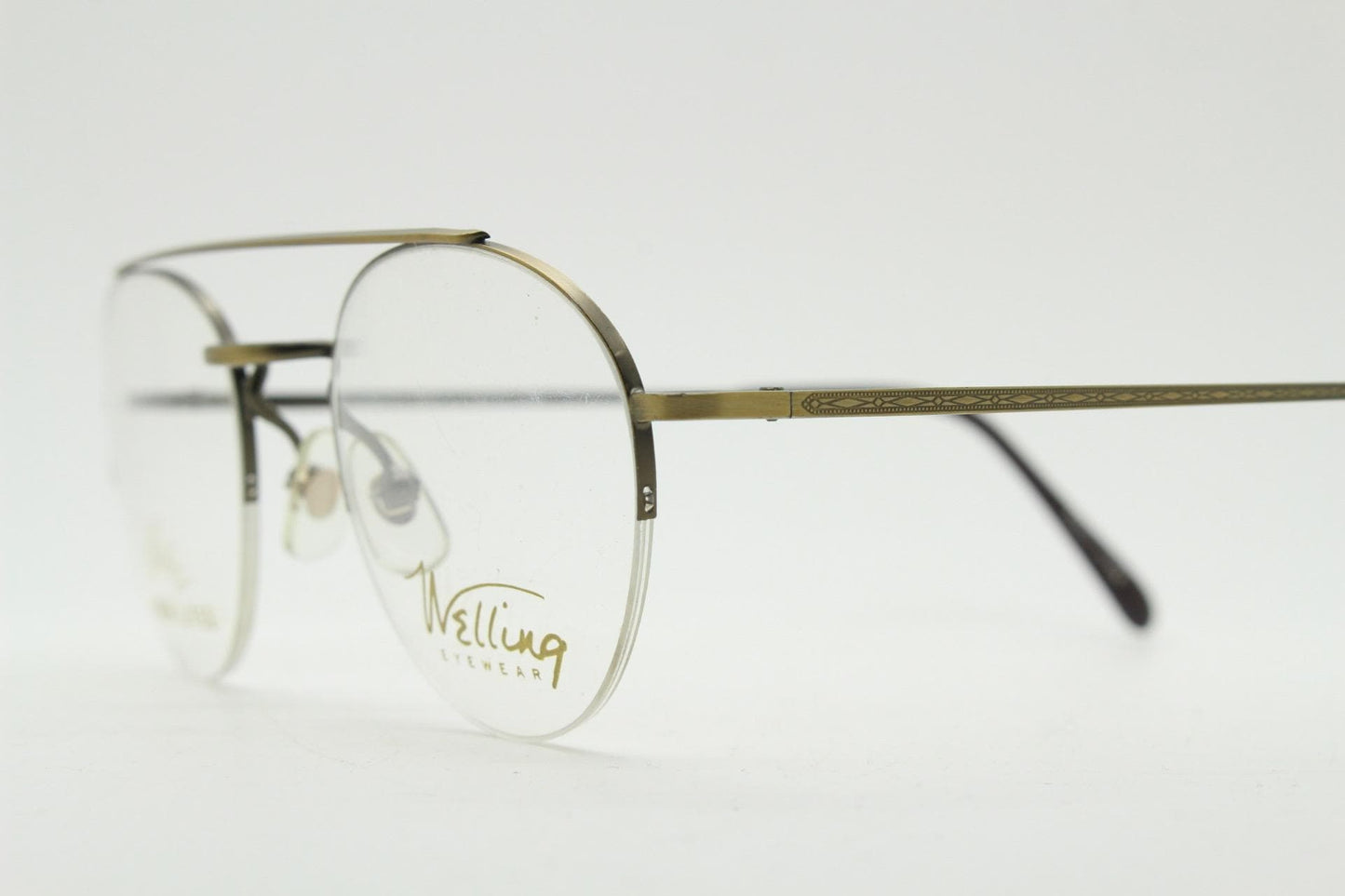 90s vintage round eye glasses made in Japan by Welling. Brushed bronze finish optical half frame. Prescription RX spectacles. NOS