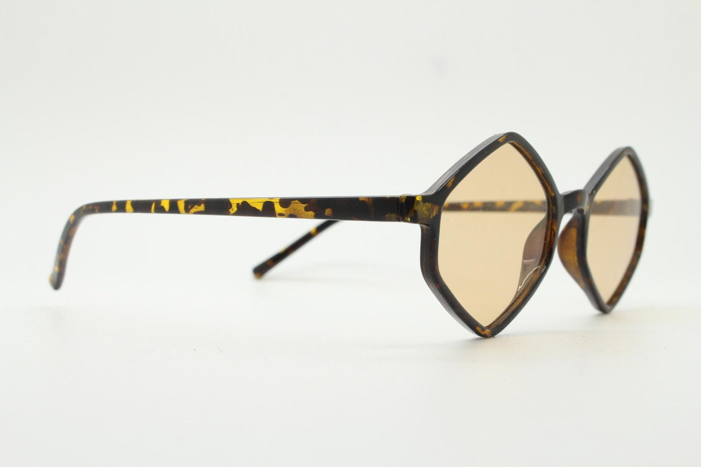 90s vintage diamond hexagon sunglasses. Atmospheric 6 sided tortoise gloss frame with very light tone brown lenses. Unused NOS
