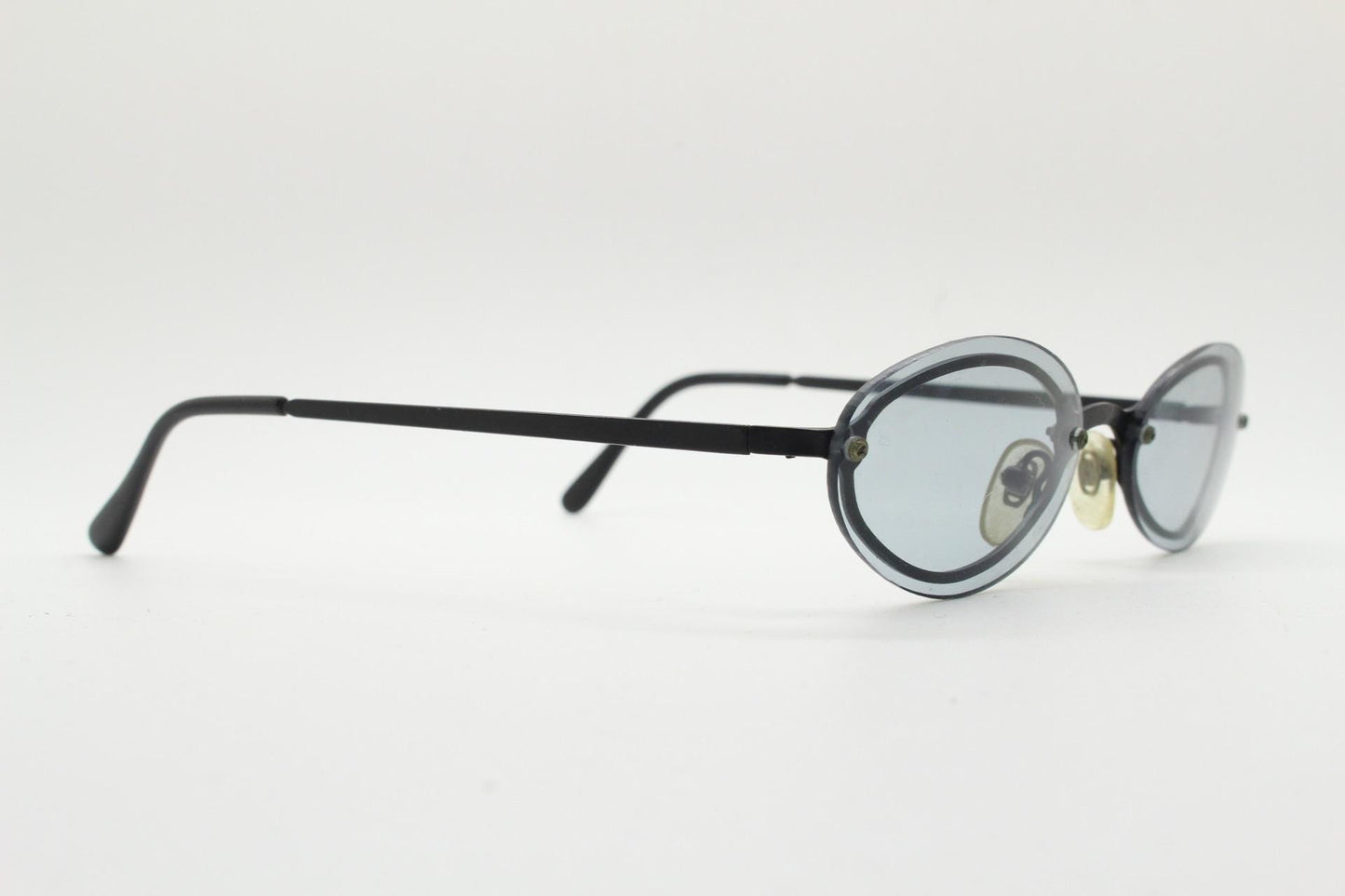 90s vintage small oval sunglasses. Minimal black metal frame with clever overlapping lens design in light tone grey. Micro. Steampunk. NOS