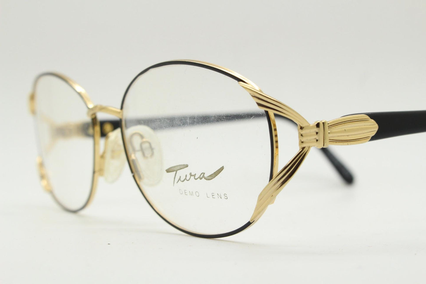 Tura 80s vintage oval eye glasses made in Italy. Womens black and gold optical frame with Y forked temples. Prescription RX. Unused NOS