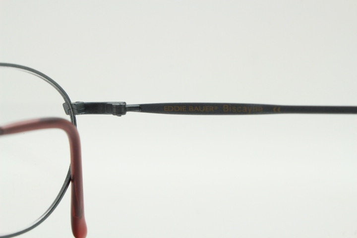 Eddie Bauer 90s vintage oval eye glasses.Grey matt finish optical frames with subtle brown trim. Prescription RX spectacles. NOS