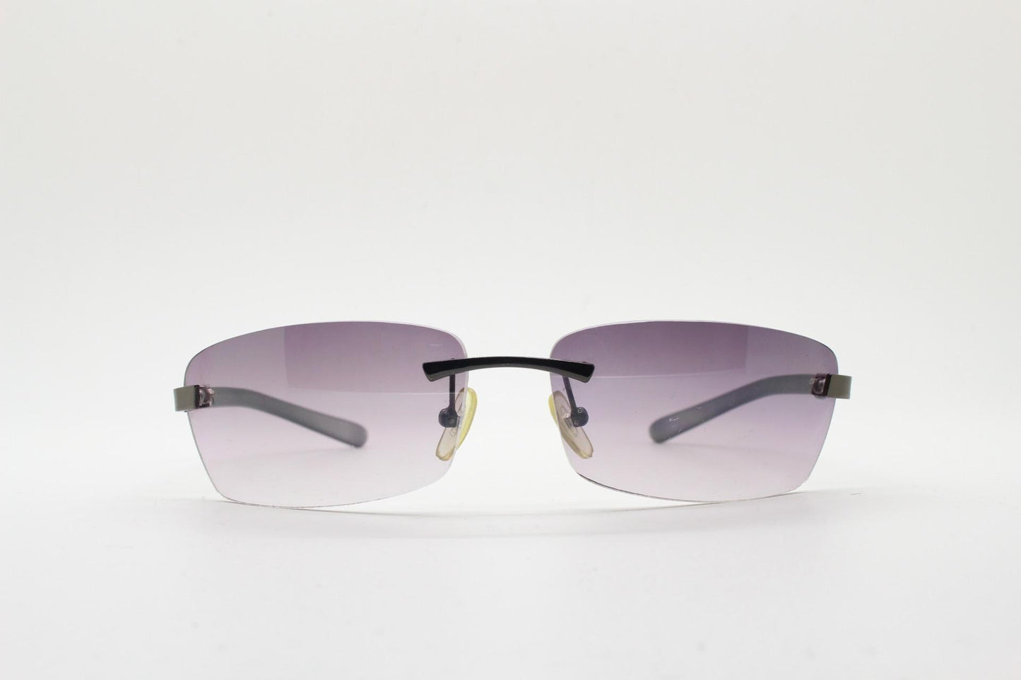 90s vintage minimal frameless sunglasses. Minimal mulberry rectangular lenses with gunmetal grey trim and frosted arms. Matrix shades