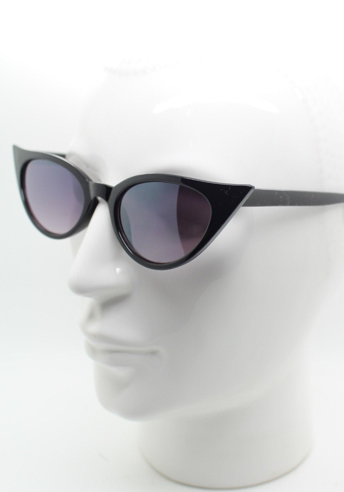 Y2K vintage pointed cat eye sunglasses. Black slender frame with graduated lenses. Womens 50s style rockabilly, pin up shades