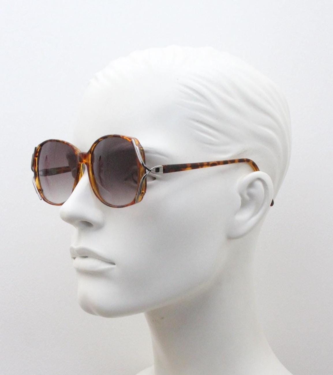 80s vintage square sunglasses. Womens honey tortoise frame with dynamic metal  forked side joints and graduating lenses. 70s. Unused NOS