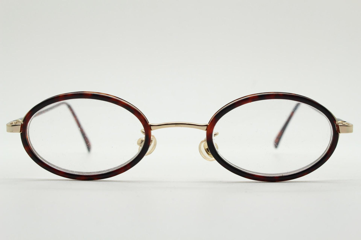 90s vintage small oval eye glasses. Gold metal frame 20s design optical frames with tortoise inserts and arms. Prescription. Spectacles NOS