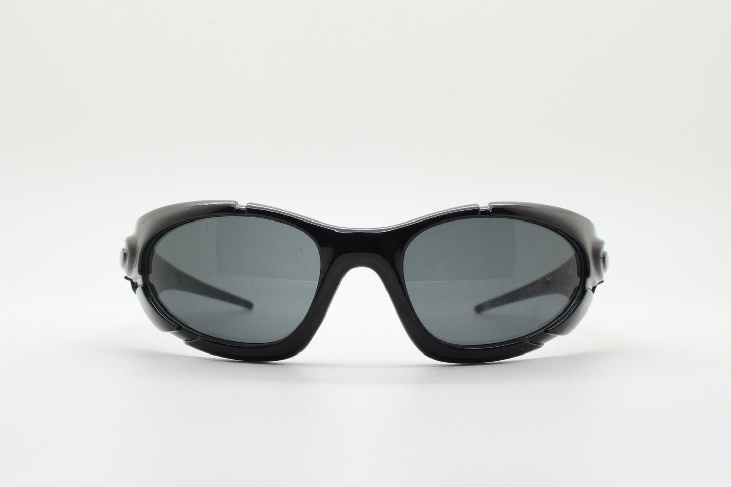 90s vintage sports shield sunglasses. All black gloss aerodynamic wraparound with many stylised features. 2000's. Hells angel uber fashion