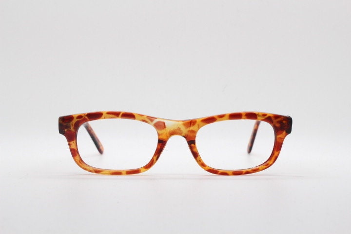 90s vintage rectangular low profile eye glasses. Transparent optical frame with vibrant amber giraffe pattern. Prescription eyeglasses. RX