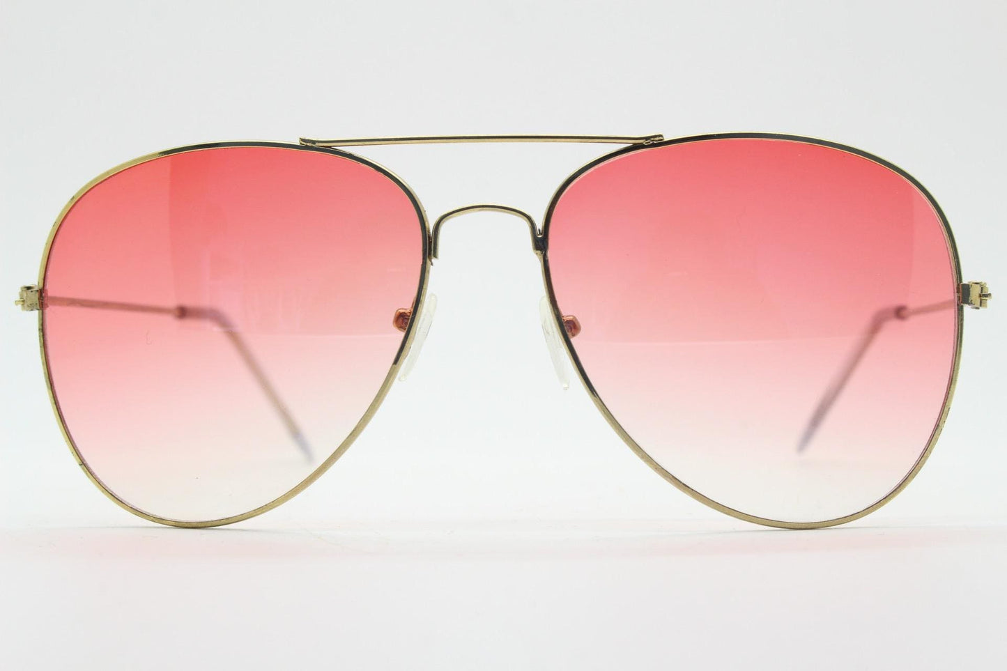 Y2K vintage aviator sunglasses. Gold metal frame pilot aviators with atmospheric light pink gradient lenses. Teardrop. 70s. 2000s. 00s NOS