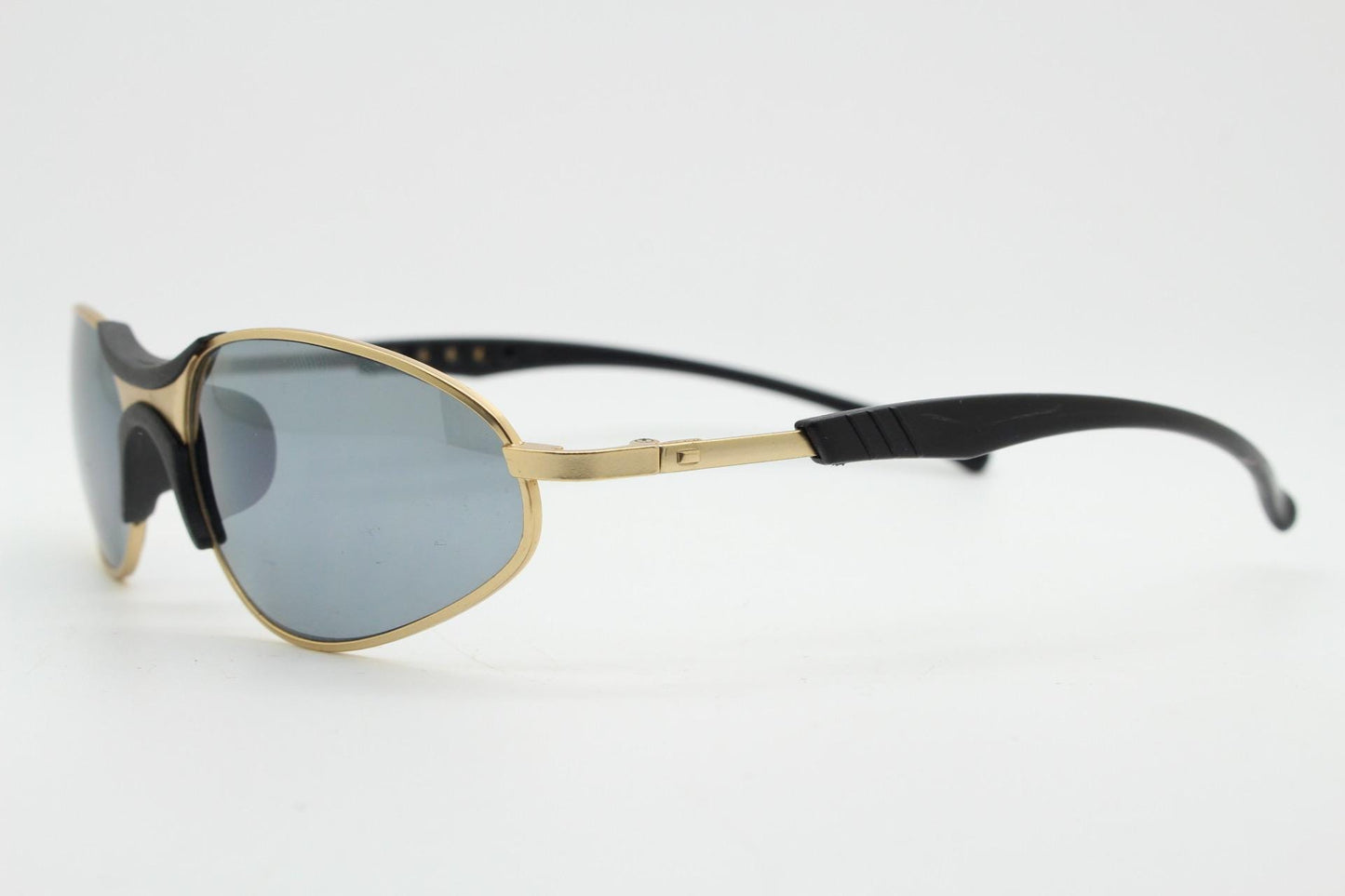 90s vintage oval small bug eye sunglasses. Curved gold satin finish metal frame with black matt trim and adjustable arm length. Unused NOS