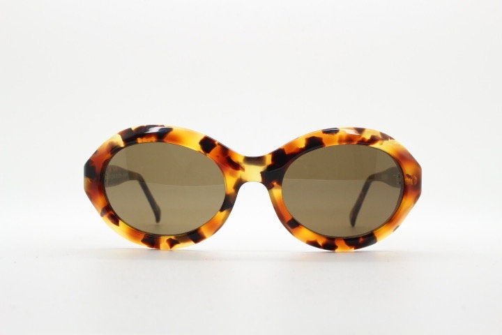 Francois Pinton Paris 90s vintage oval sunglasses made in France. Womens thick acetate frame in brown and amber tones. NOS