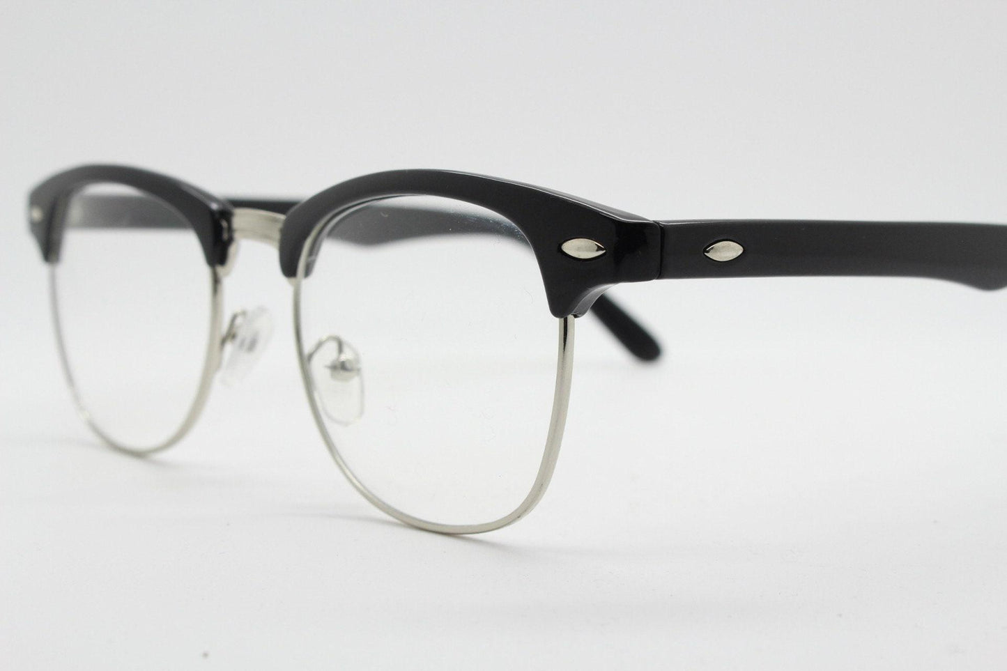 90s vintage black half frame eye glasses. Black gloss browline with silver wire rim frame and clear lenses. Classic 50s, 60s design. NOS