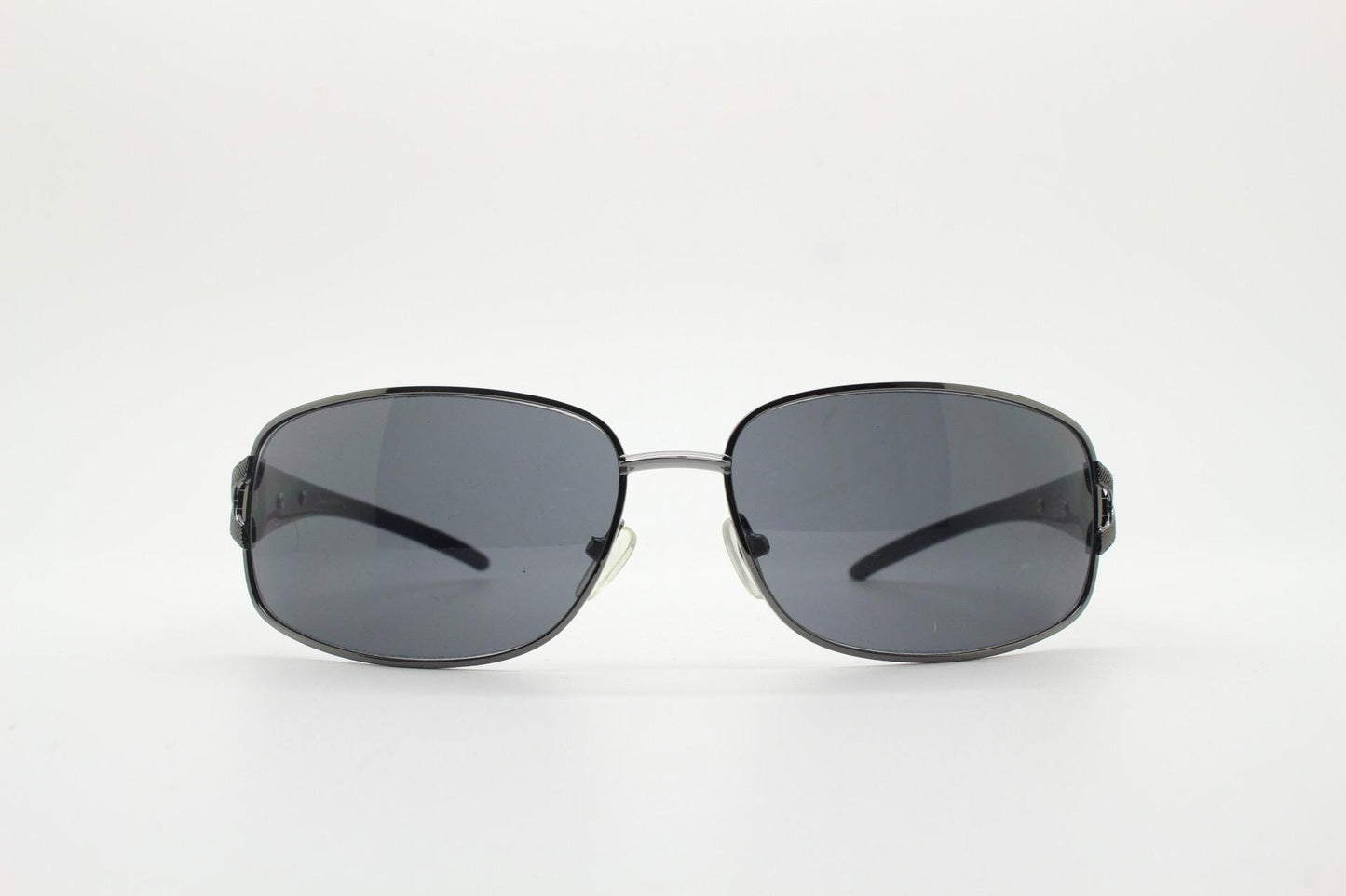 2000s vintage rectangular bug eye sunglasses. Solid metal slightly oversized grey chrome frame with diamond lattice arm detail. Y2K NOS