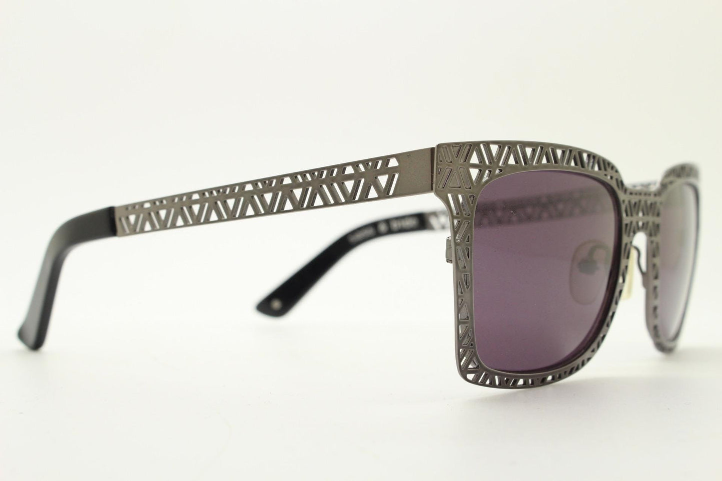 Sass and bide vintage wayfarer shape sunglasses. Gunmetal grey flat metal frame with cut out patterns throughout and black lenses. 2000s NOS