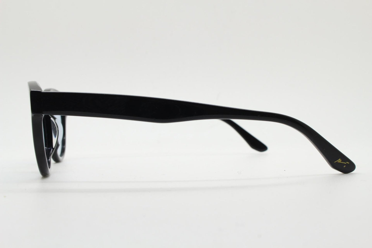 Vintage modified wayfarer design sunglasses. Black gloss acetate frame with extra light tone blue lenses in ideal proportions. NOS