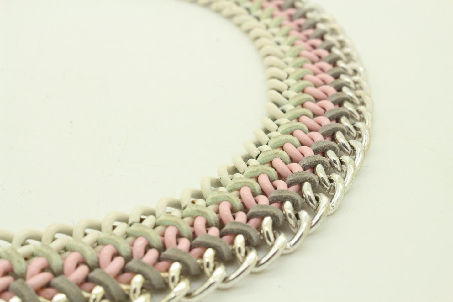 90s vintage 3 tier chain necklace. Solid metal construction in silver, pink, and white tones with grey rubber bonds. Adjustable back