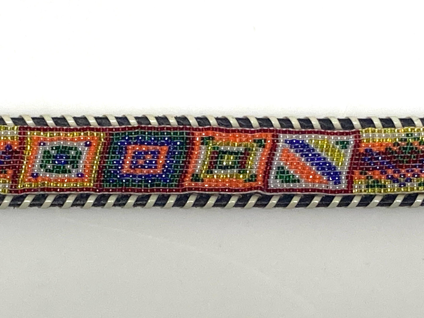 80s vintage thick Leather Native American Indian style belt. Full beaded applique, looped tape edge, embossed pattern and textured buckle