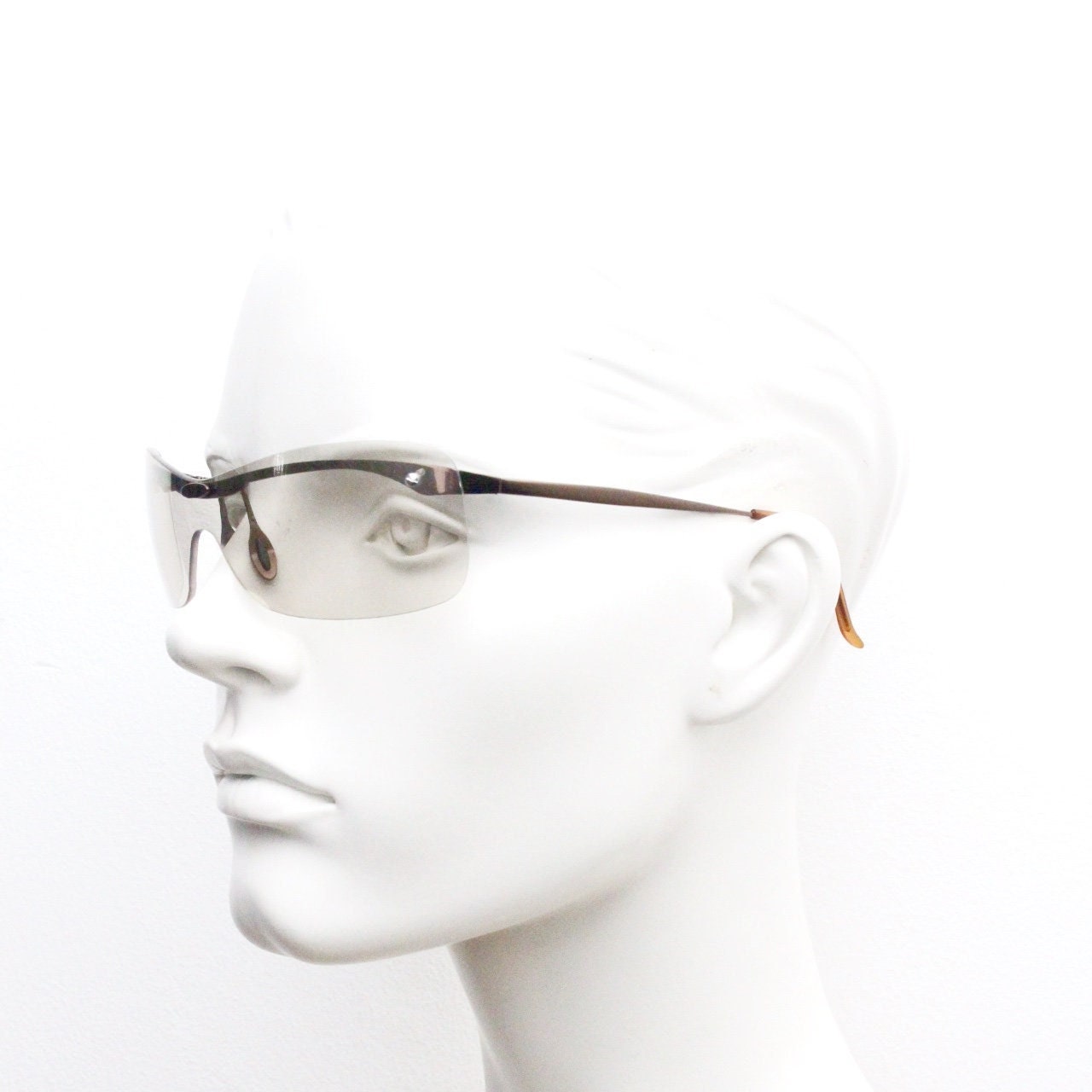 Y2K vintage visor sunglasses. 2000's wrap around sport shield design. Brown chrome brow with light tone lens. NOS 00's. 90S