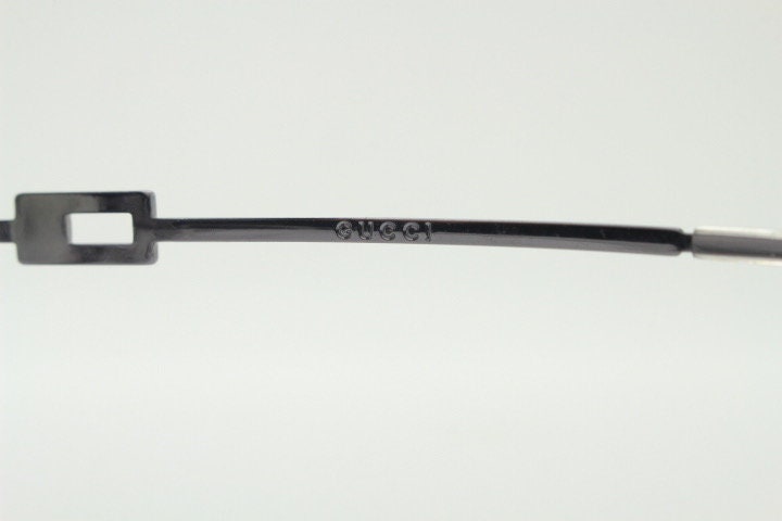 Gucci rectangular eye glasses made in Italy. Slim metal wire low profile optical half frame with diamante logo. Prescription eyeglasses. RX