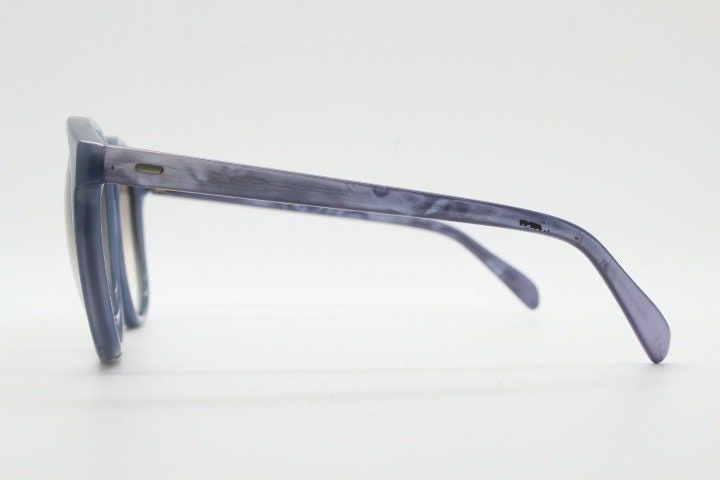 Michele L'Amy 80s vintage round sunglasses made in France. Lustrous marbled blue frame with keyhole bridge and graduating brown lenses