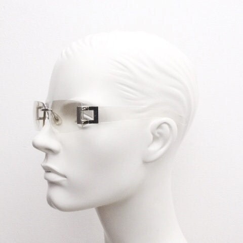 Y2K vintage wraparound sunglasses. Minimal frameless light tone curved mirrored lenses with silver chrome trim. 2000's. 90s. 00s. NOS