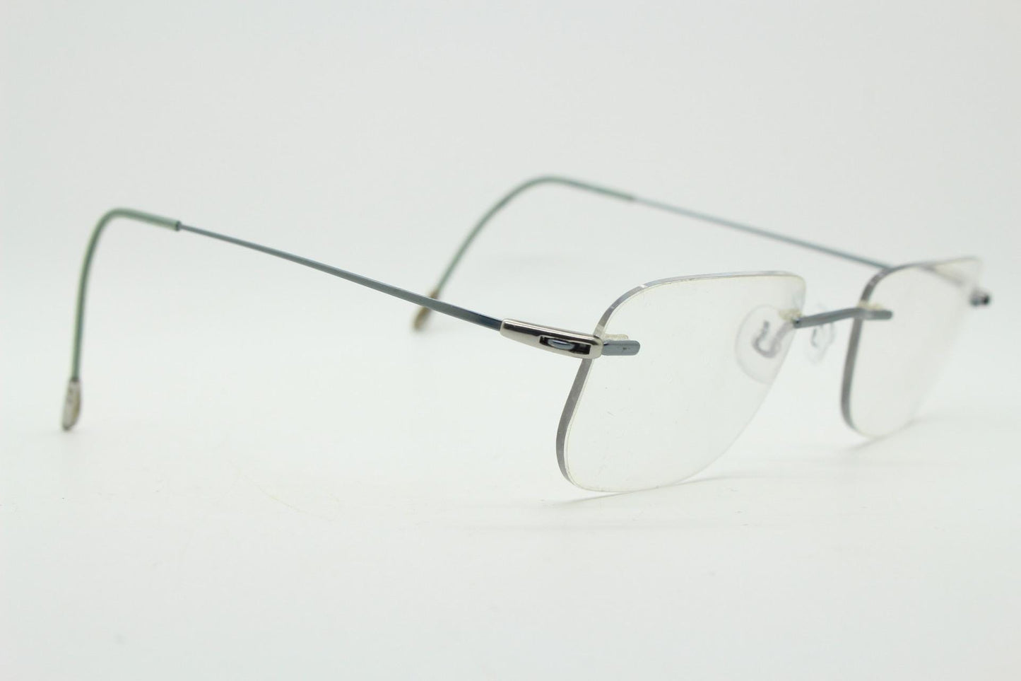 Silhouette rectangular frameless eye glasses model 7554 made in Austria. Minimal lightweight titanium optical frame. Prescription RX