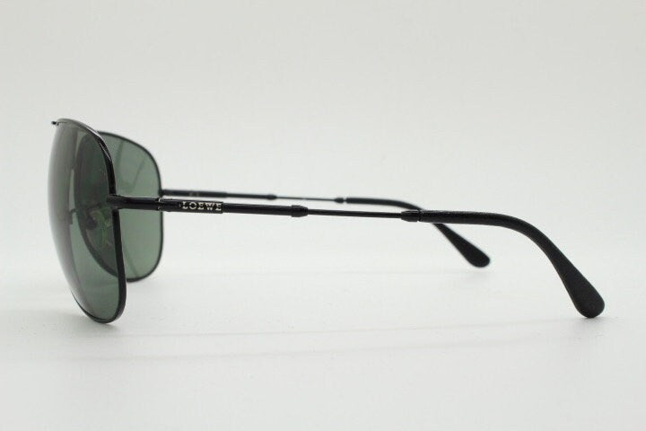 Loewe vintage aviator sunglasses in a tall black gloss frame with dark green lenses. Mens large teardrop pilot aviators. Y2K New Old Stock