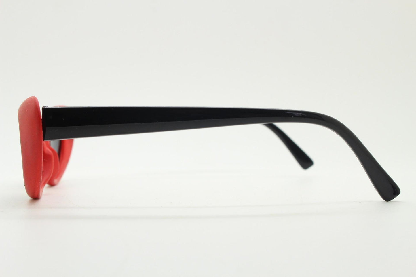 Vintage 80s oval cat eye sunglasses. Dynamic red rubber front with black gloss arms. Hyper real cosplay cateye. New wave punk