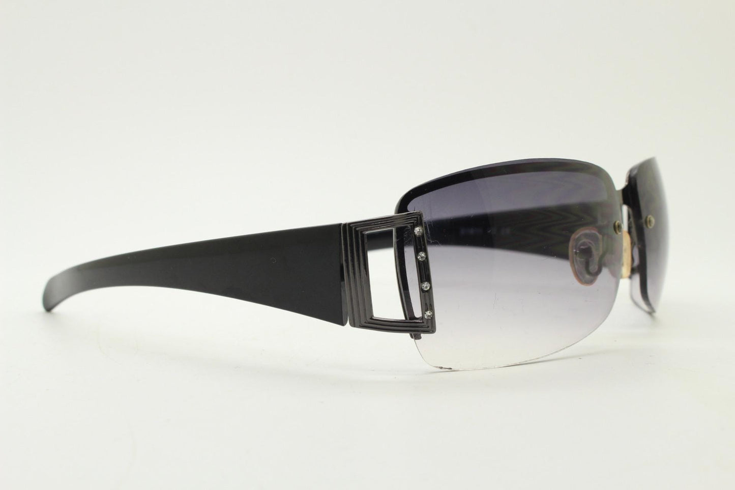 Y2K vintage rectangular wrap around sunglasses. Black half frame with grey metal trim, diamante detail and graduating lenses. Rhinestone