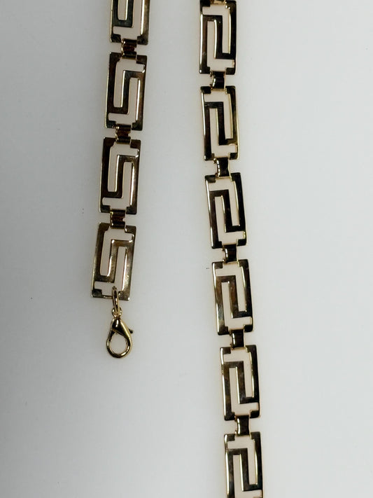 Y2k vintage womens decorative chain belt. Shiny gold chrome steel in a classical pattern with hanging end. Festival. Hippy. 2000s NOS