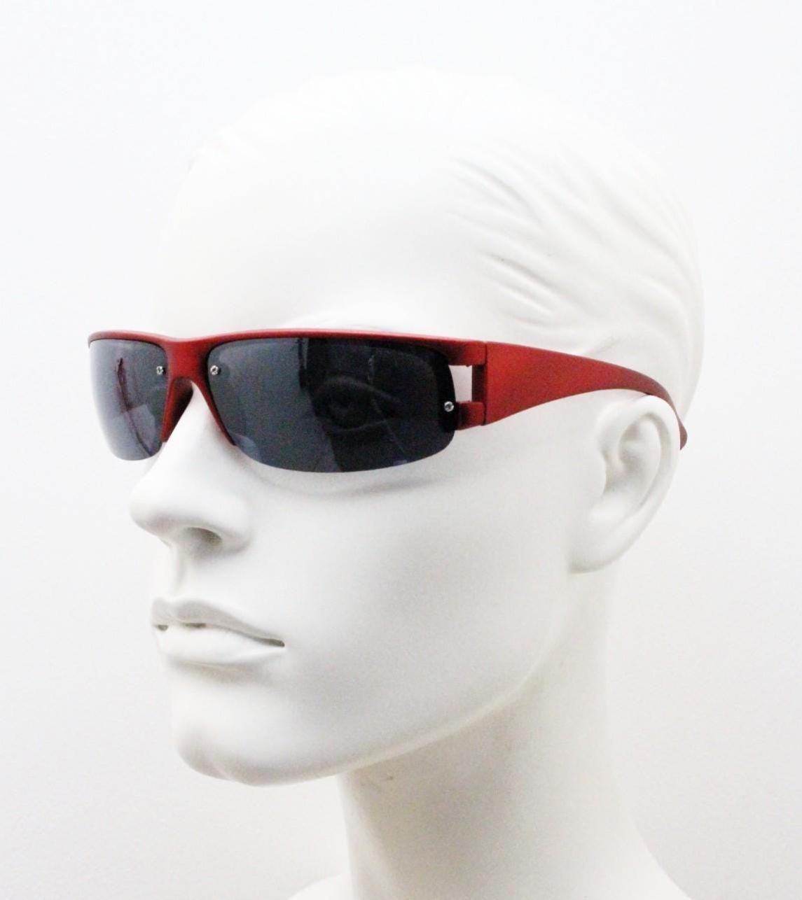 90s vintage visor sunglasses. Red matt metallic curved half frame wrap around sports shield with dark lenses. Mini mask. 2000's. Y2K NOS