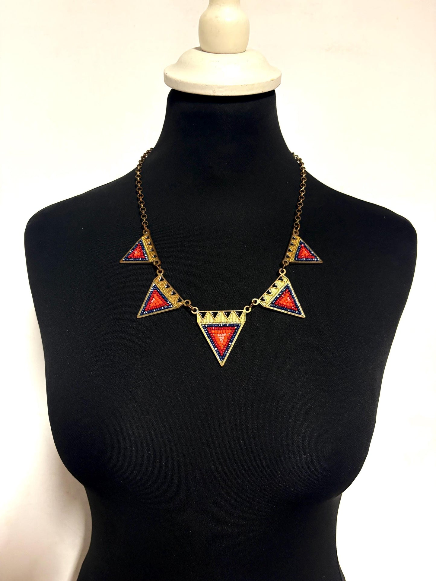 80s vintage gold triangles necklace. Aztec style with multi coloured bead inlays and ornate patterns. Womens statement design