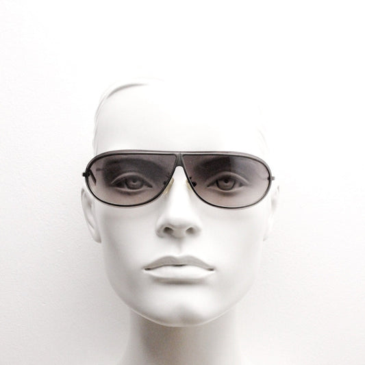 Y2K vintage visor aviator sunglasses. 2000's black low profile wraparound mono lens mini mask shield design with slim gunmetal arms. 00s NOS