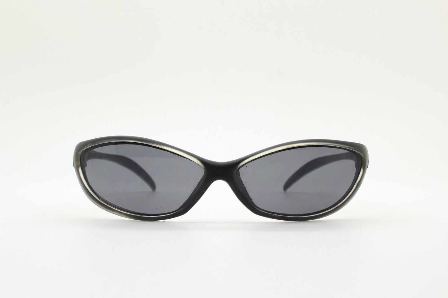 90s vintage curved wraparound sunglasses. Aerodynamic low profile transparent grey frosted frame. Minimal sporty shield design. NOS