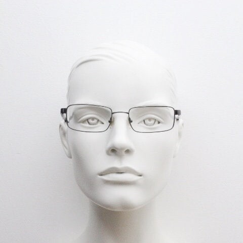 Calvin Klein collection rectangular eye glasses model 582 made in Japan. Gunmetal grey wire optical frames. Prescription eyeglasses. RX