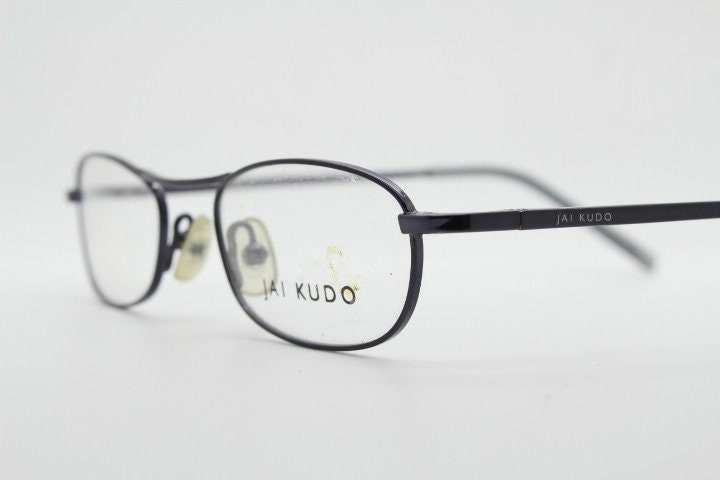 Jai Kudo 90s vintage oval eye glasses. Small low profile optical frames in charcoal grey chrome. Prescription eyeglasses. RX Spectacles
