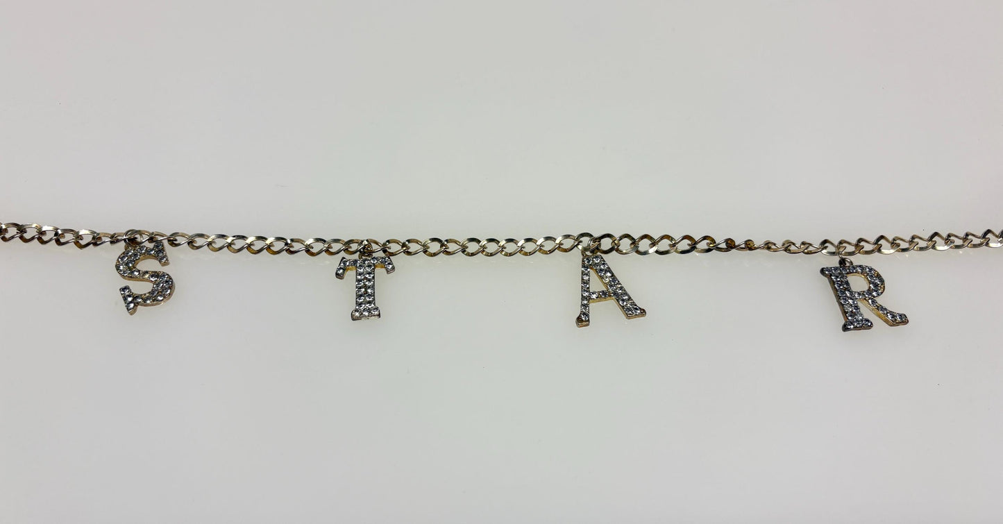 Y2K vintage womens slim chain belt with diamante STAR. Shiny chrome steel with  hanging diamante studded letters. Rhinestone. 2000s NOS