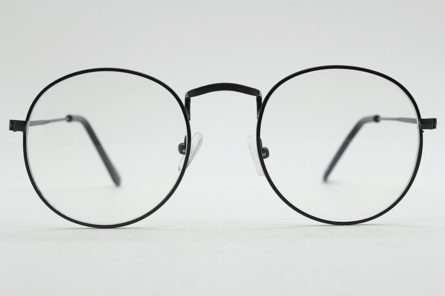 90s vintage round metal glasses. Classic 60s panto design black frame with clear lenses in excellent proportions. Unused NOS eyeglasses