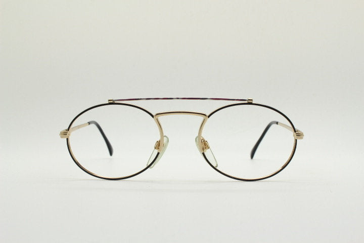 90s vintage oval eye glasses. Gold metal optical frame with vibrant enamel pattern and prominent double bridge. Prescription spectacles. NOS