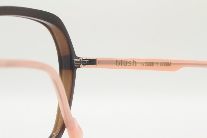 Caroline Abram square hexagon eye glasses model Caline. Dark brown acetate optical frame with pink arms. Prescription RX spectacles