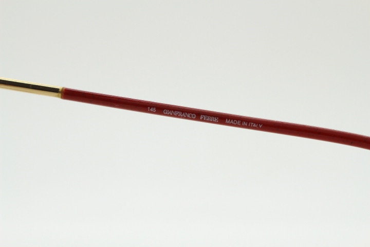 Gianfranco Ferre 90s vintage oval eye glasses made in Italy. Red and gold metal tech design optical frame. Prescription RX. NOS