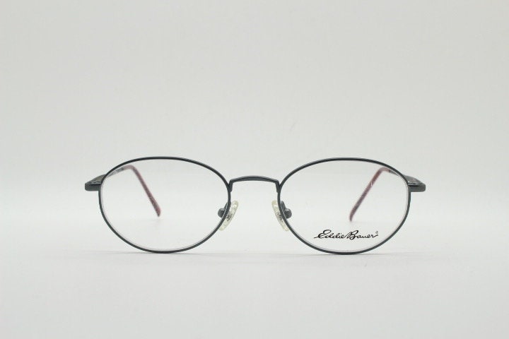 Eddie Bauer 90s vintage oval eye glasses.Grey matt finish optical frames with subtle brown trim. Prescription RX spectacles. NOS