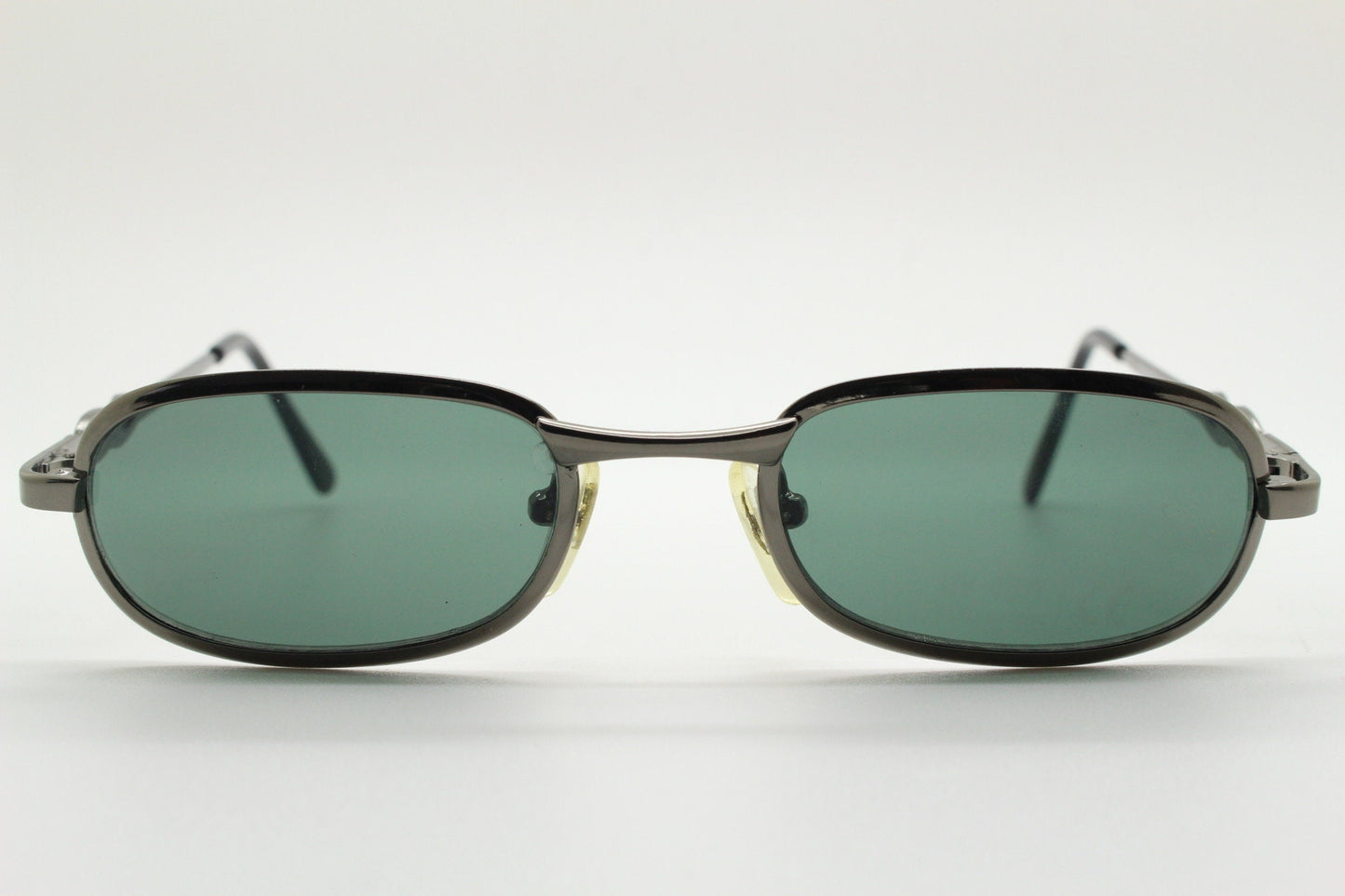 90s vintage oval solid metal sunglasses. Minimal gunmetal grey chrome frame with dark green lenses. Steampunk. Micro. Unused NOS