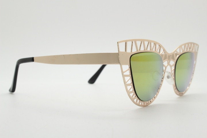 Y2K vintage metal cat eye sunglasses. Women's extraordinary gold cut out lattice scaffold cateye frame with gold mirror lenses. 2000s. BNWT